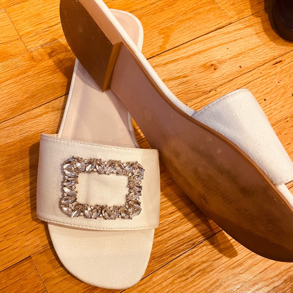 White slides with a rhinestone design